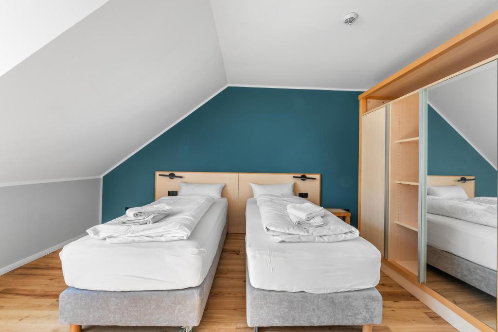 Postel nebo postele na pokoji v ubytování Hotel Friedrichstadt