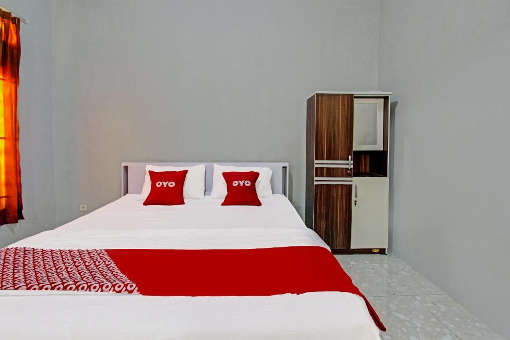 Postel nebo postele na pokoji v ubytování OYO 91210 Hotel J3
