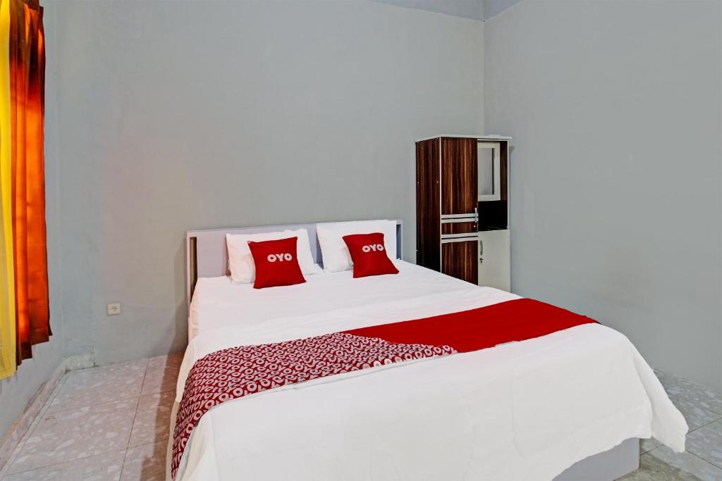 Postel nebo postele na pokoji v ubytování OYO 91210 Hotel J3