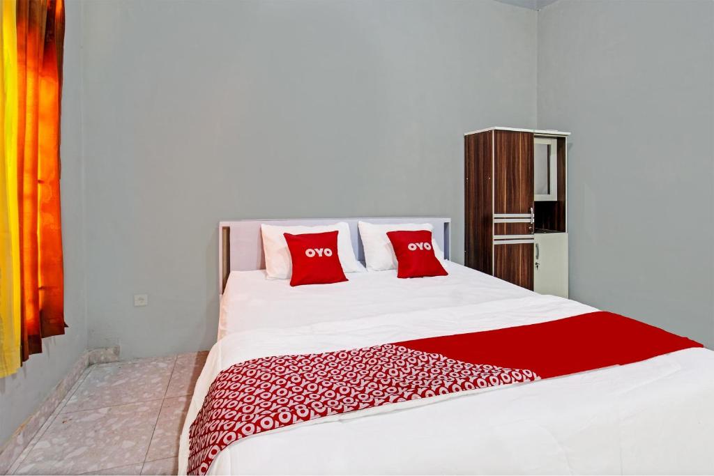 Postel nebo postele na pokoji v ubytování OYO 91210 Hotel J3