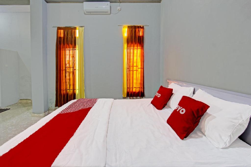 Postel nebo postele na pokoji v ubytování OYO 91210 Hotel J3