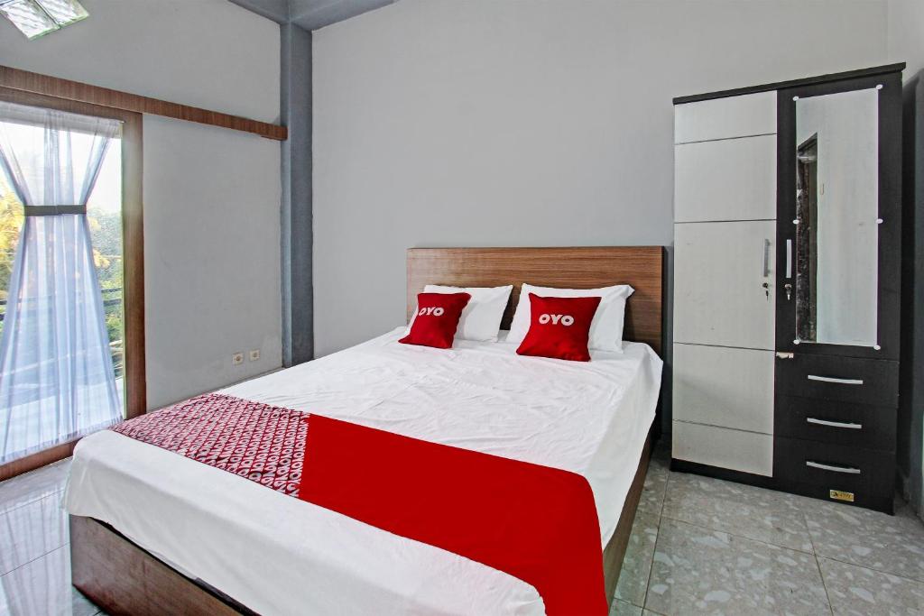 Postel nebo postele na pokoji v ubytování OYO 91210 Hotel J3
