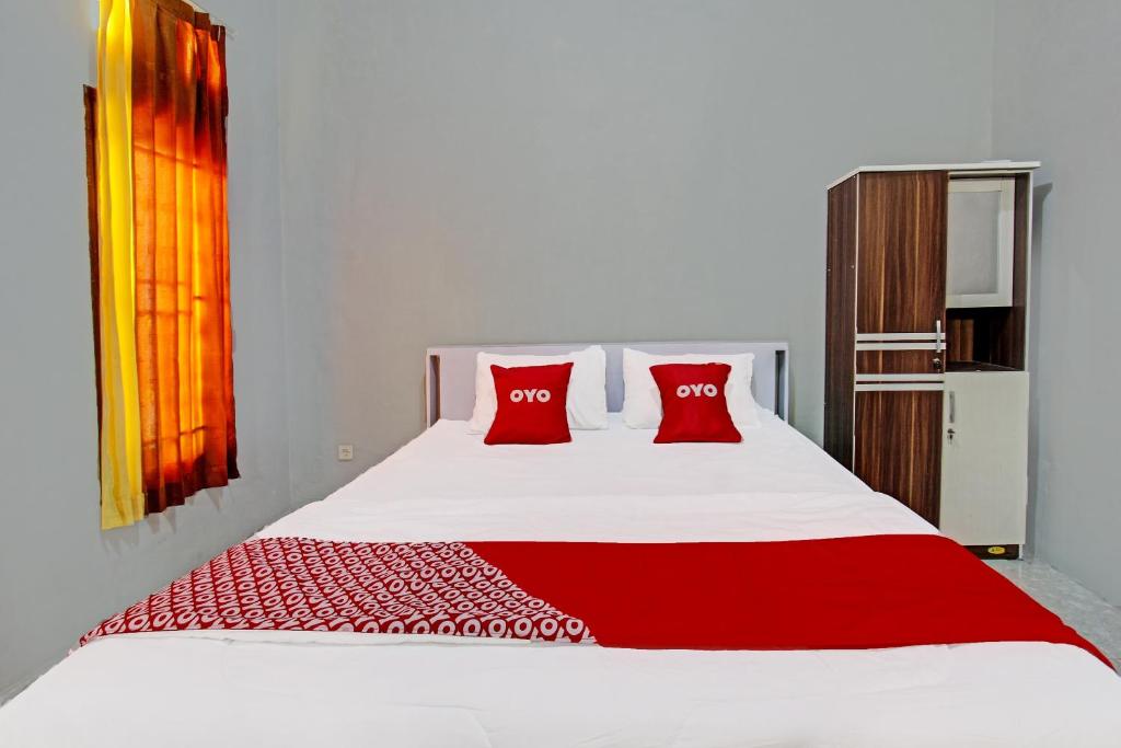 Postel nebo postele na pokoji v ubytování OYO 91210 Hotel J3