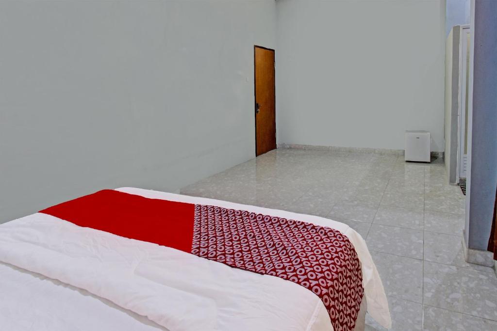Postel nebo postele na pokoji v ubytování OYO 91210 Hotel J3