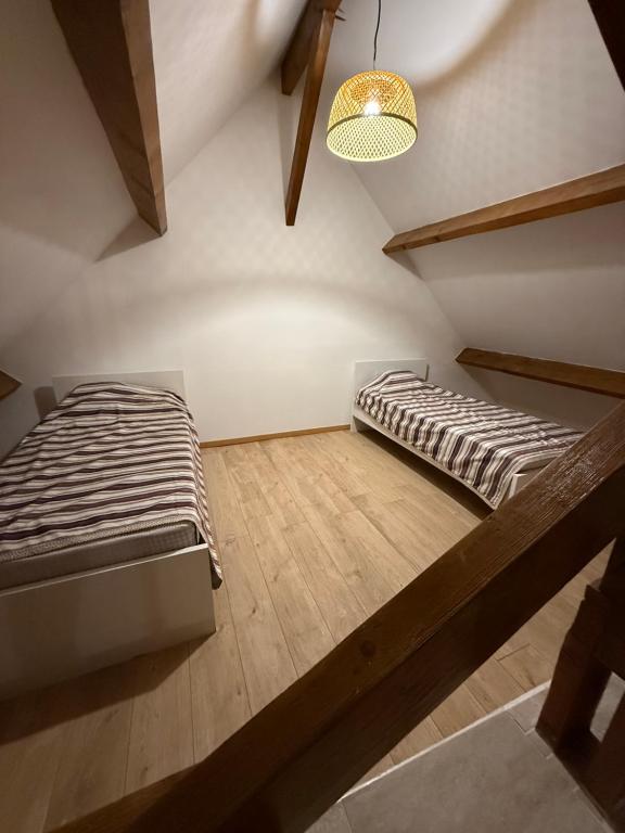 Postel nebo postele na pokoji v ubytování Chambre dans une Ecurie