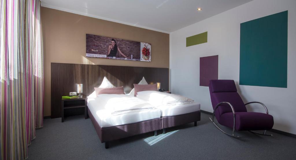 Postel nebo postele na pokoji v ubytování GS Hotel
