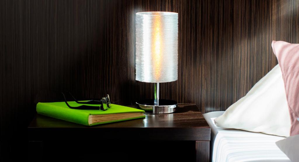 Postel nebo postele na pokoji v ubytování GS Hotel