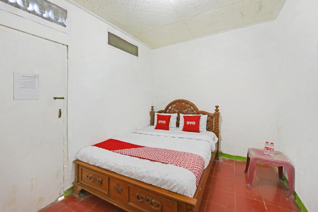 Postel nebo postele na pokoji v ubytování SPOT ON 91270 Hotel Arimbi