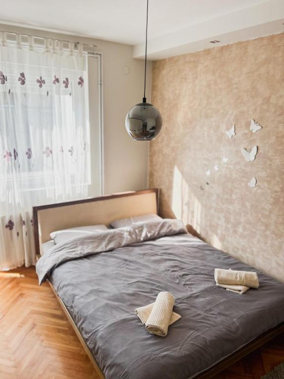 Postel nebo postele na pokoji v ubytování Elena apartman