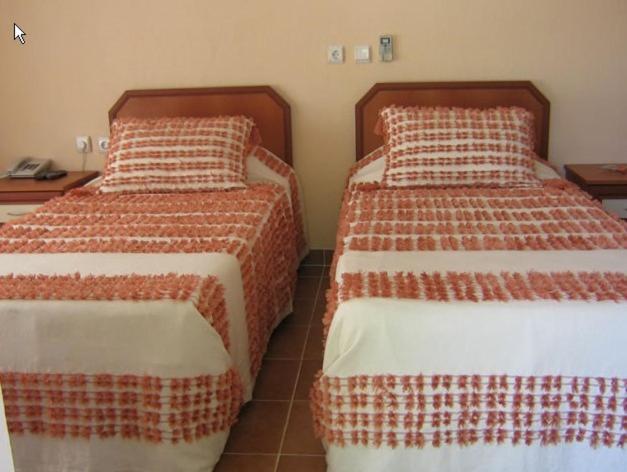 Postel nebo postele na pokoji v ubytování Alize Hotel