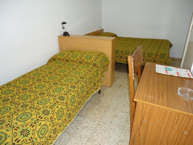 Postel nebo postele na pokoji v ubytování Residència Restaurant Indalo