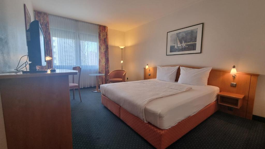 Postel nebo postele na pokoji v ubytování Hotel Panorama Hamburg-Billstedt