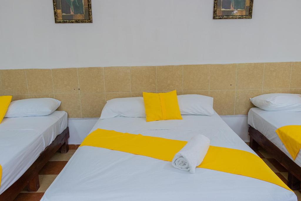 Postel nebo postele na pokoji v ubytování OYO Hotel Marías,Aeropuerto Internacional de Chetumal