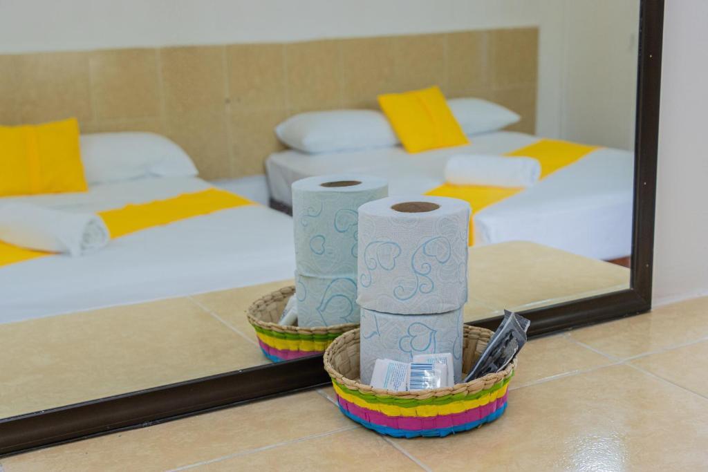Postel nebo postele na pokoji v ubytování OYO Hotel Marías,Aeropuerto Internacional de Chetumal