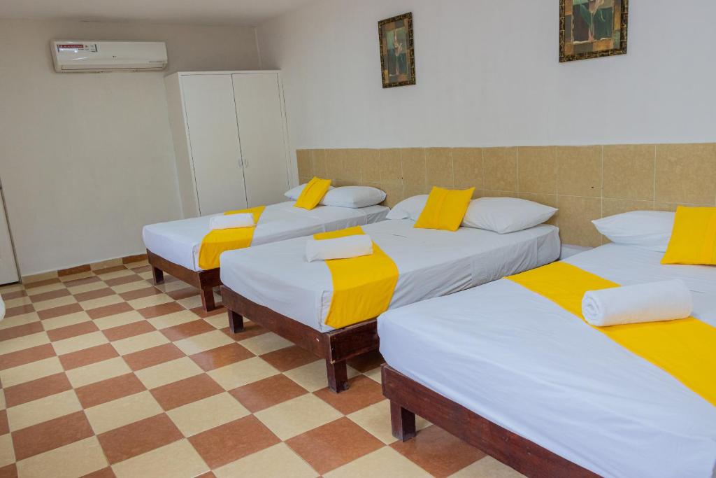 Postel nebo postele na pokoji v ubytování OYO Hotel Marías,Aeropuerto Internacional de Chetumal