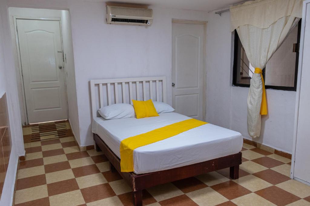 Postel nebo postele na pokoji v ubytování OYO Hotel Marías,Aeropuerto Internacional de Chetumal
