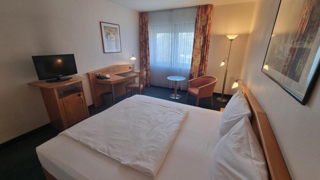 TV a/nebo společenská místnost v ubytování Hotel Panorama Hamburg-Billstedt