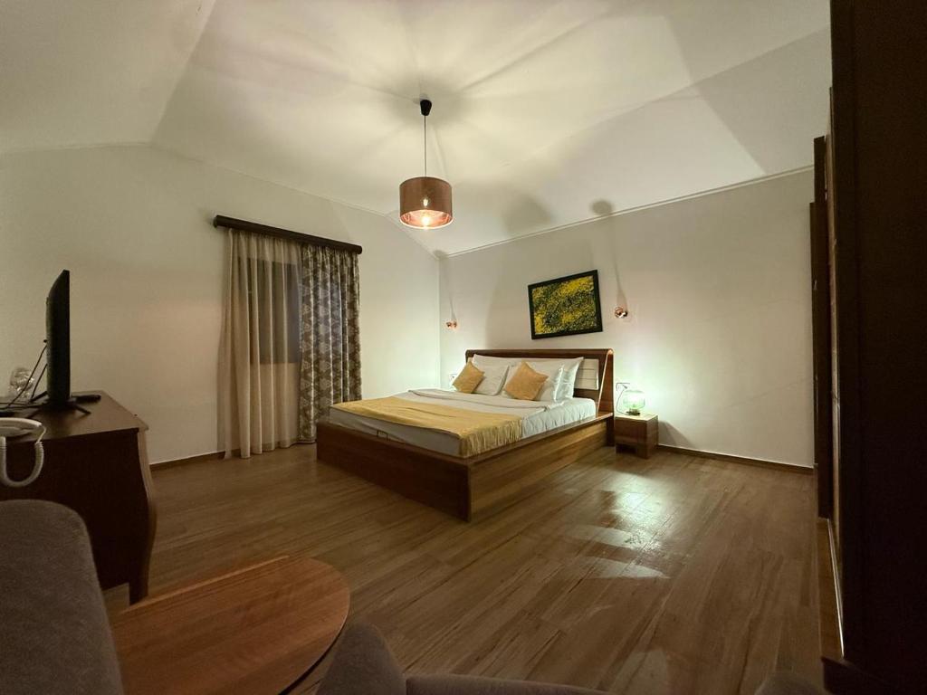 Postel nebo postele na pokoji v ubytování Forte Rose Hotel