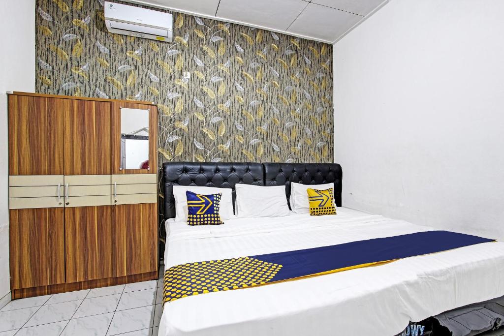 SPOT ON 91521 Mayong Guesthouse - Chambre Triple Économique
