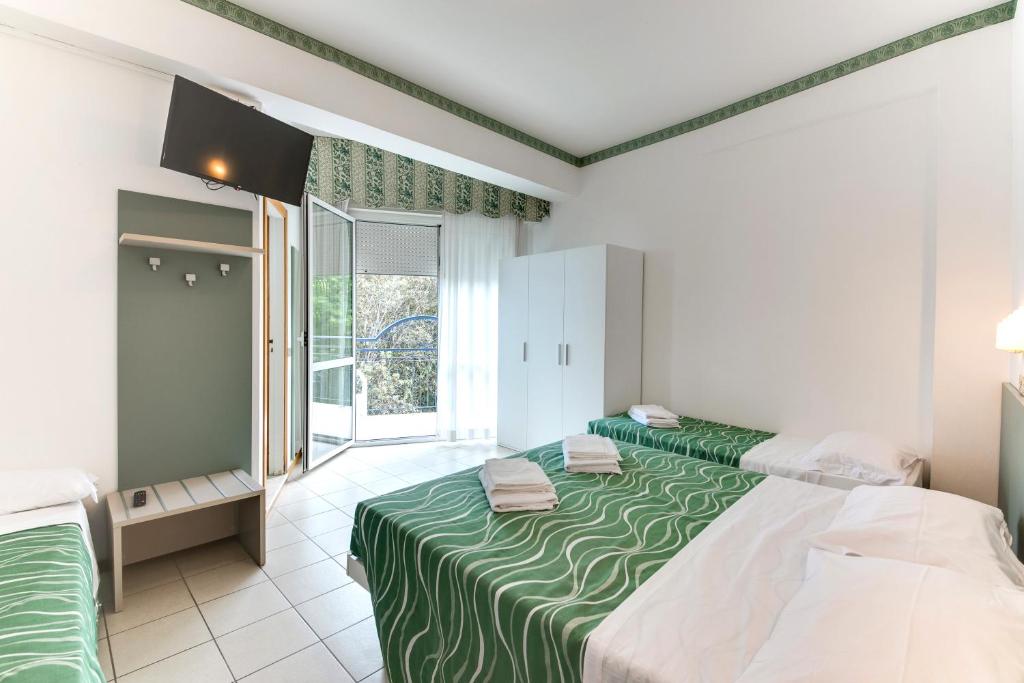 Postel nebo postele na pokoji v ubytování Hotel Internazionale