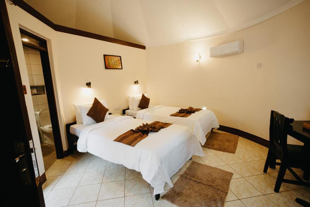 Postel nebo postele na pokoji v ubytování Keys Hotel