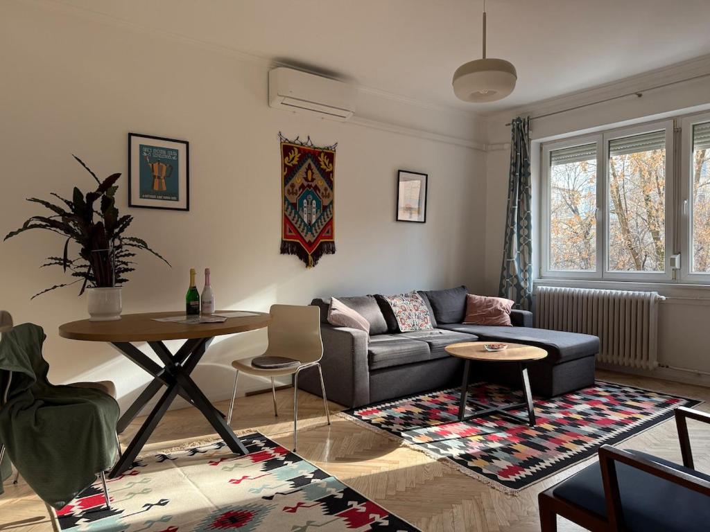 a living room with a couch and a table at Buda's Crib apartment in Budapest