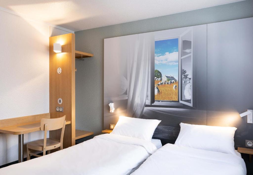 Postel nebo postele na pokoji v ubytování B&B HOTEL Auray Carnac