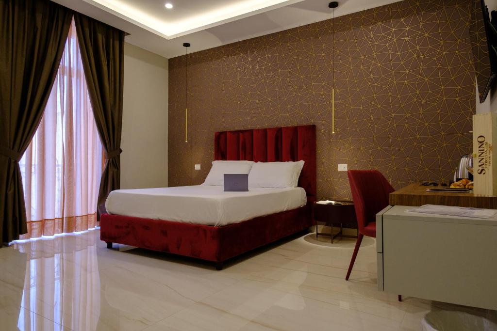 Postel nebo postele na pokoji v ubytování Palazzo Adele Rooms & Apartments
