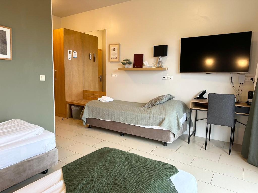 Postel nebo postele na pokoji v ubytování Hotel Laki