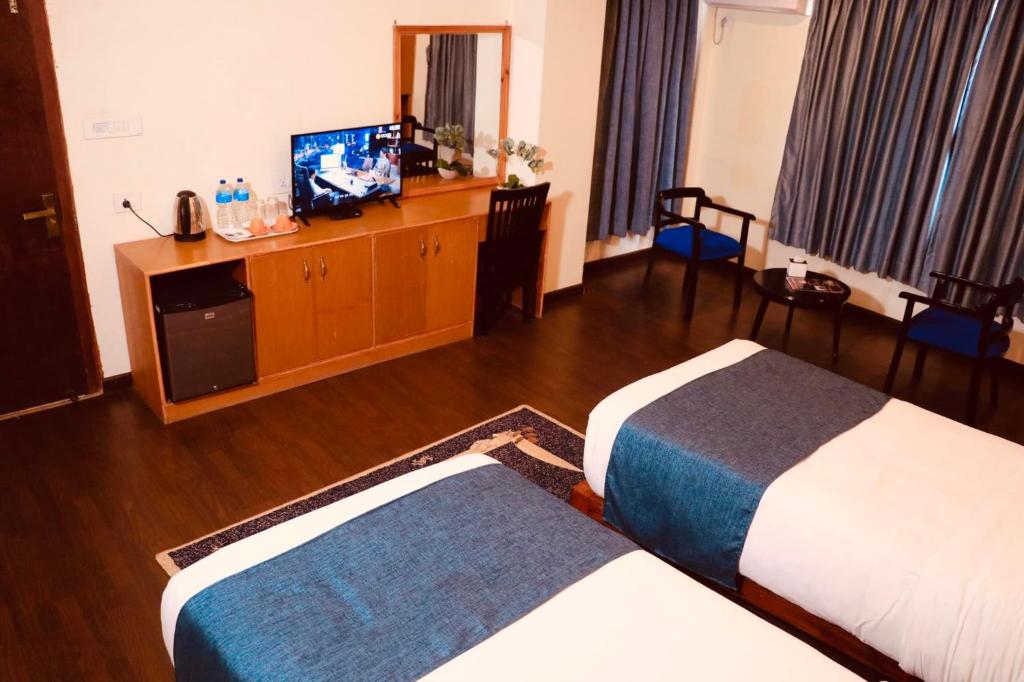 Postel nebo postele na pokoji v ubytování Satkar Hotel Kathmandu