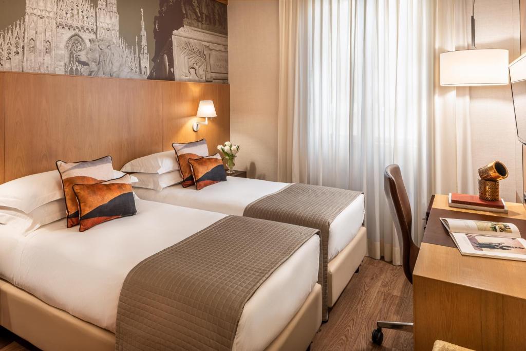 Postel nebo postele na pokoji v ubytování Starhotels Ritz