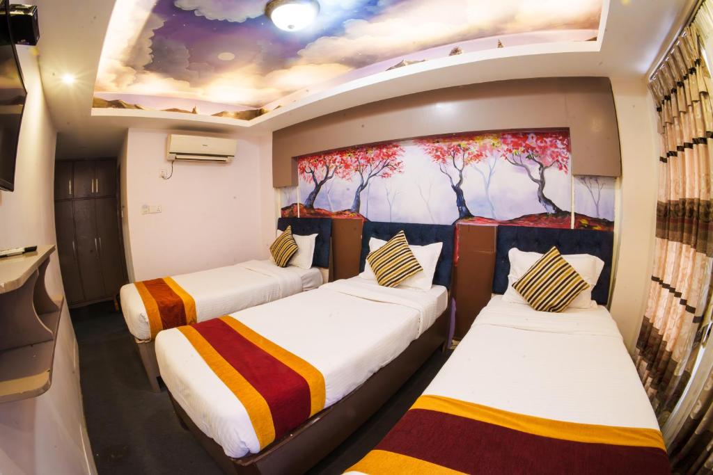 Postel nebo postele na pokoji v ubytování Hotel Kathmandu square
