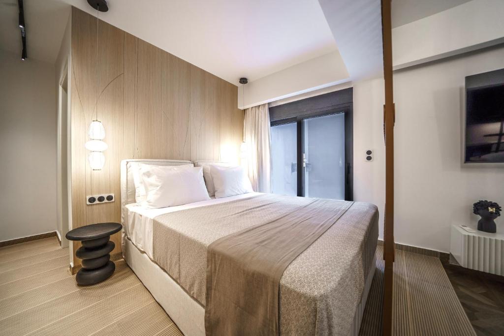 Postel nebo postele na pokoji v ubytování Allegro Suites