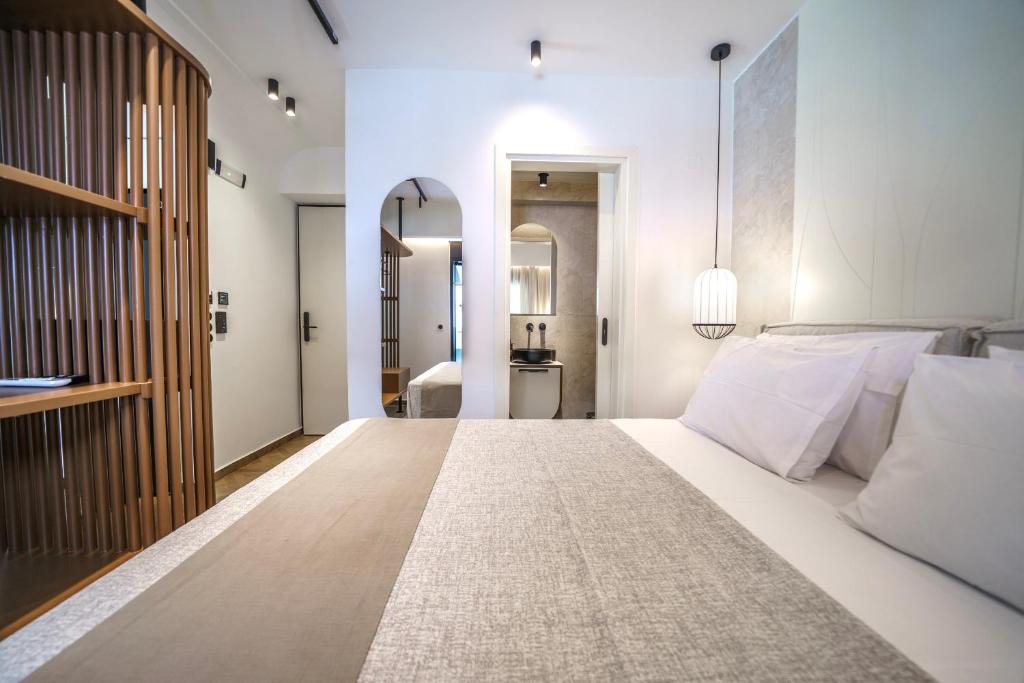 Postel nebo postele na pokoji v ubytování Allegro Suites