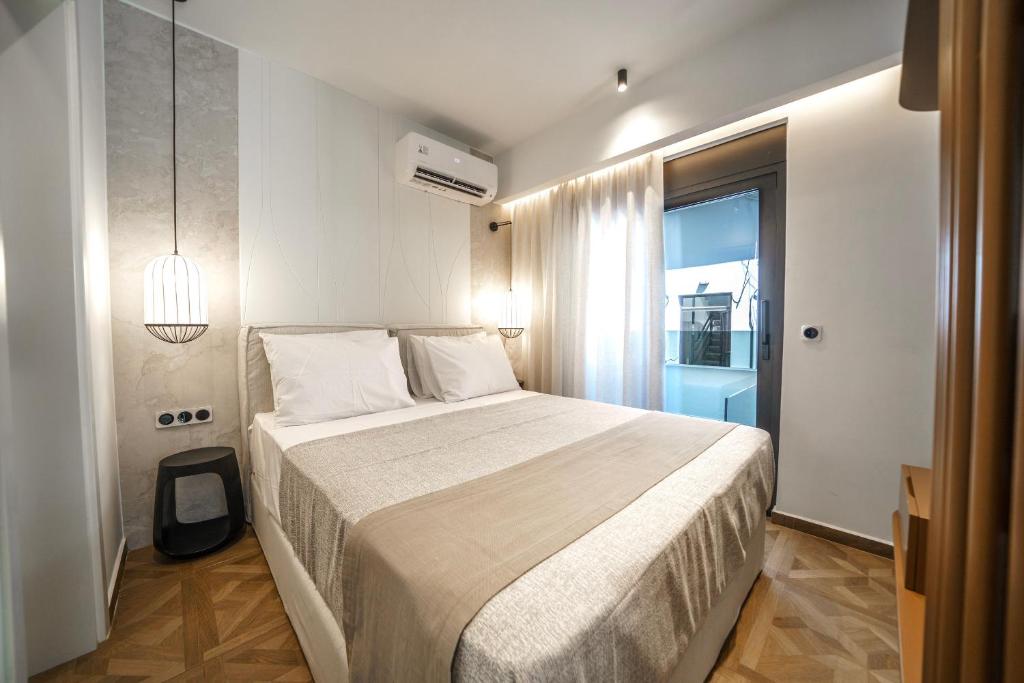 Postel nebo postele na pokoji v ubytování Allegro Suites
