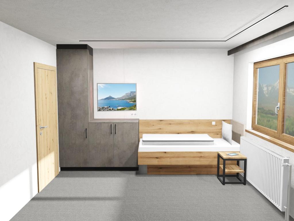 A bed or beds in a room at Haus Enzian