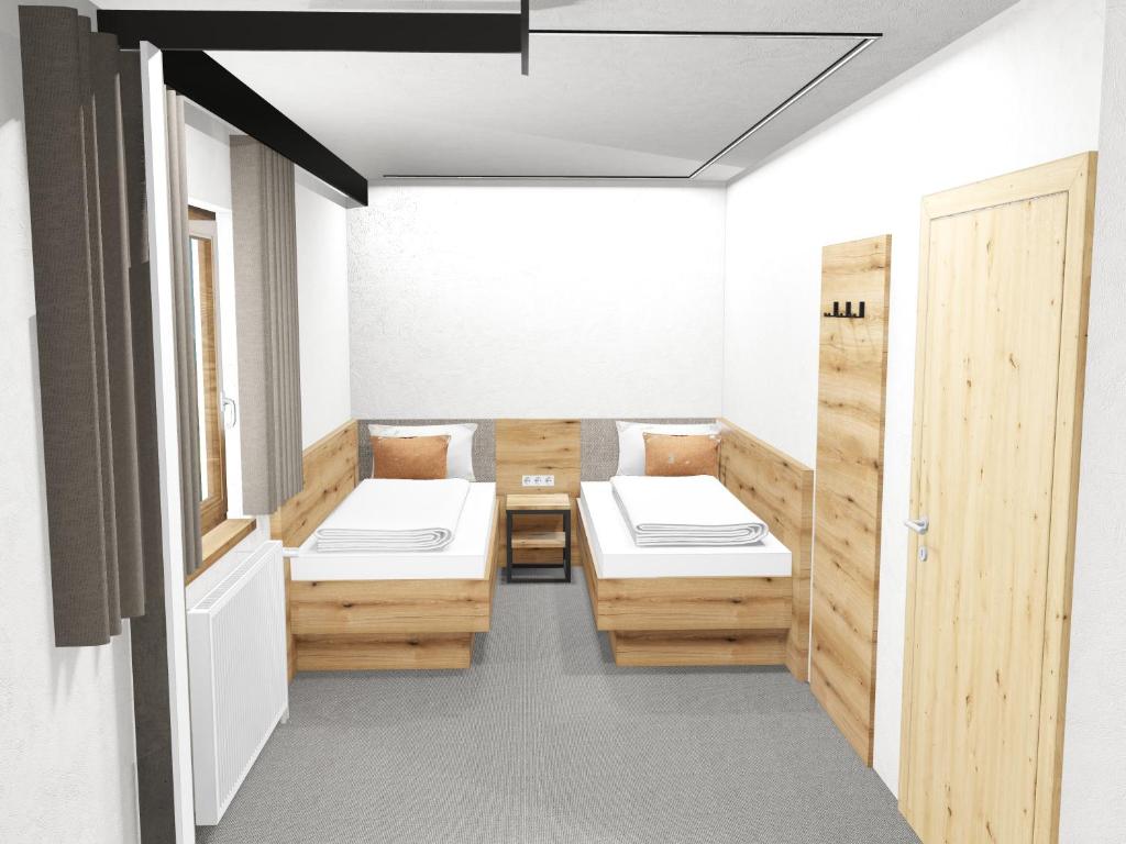 A bed or beds in a room at Haus Enzian