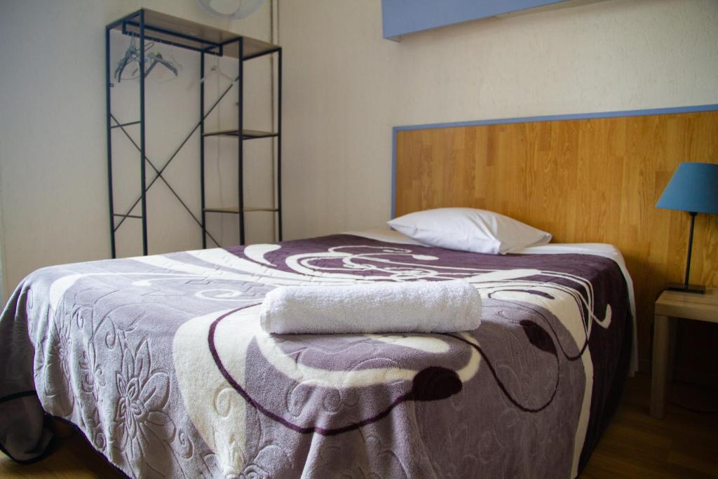 Postel nebo postele na pokoji v ubytování Hotel Durand Le Patio