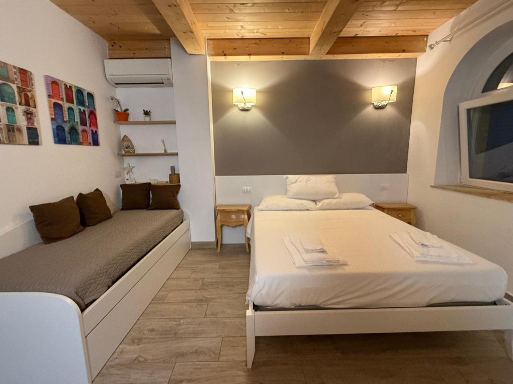 a room with two beds in a room at Conchiglia Doro in Civitanova Marche