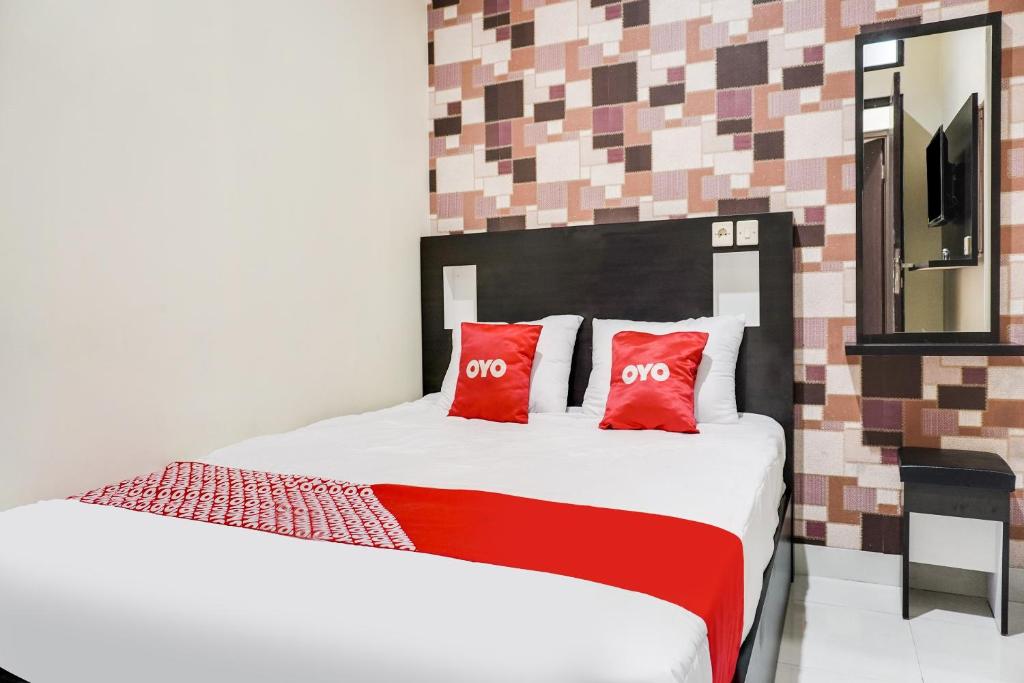 Postel nebo postele na pokoji v ubytování OYO 91646 fio colombus residence