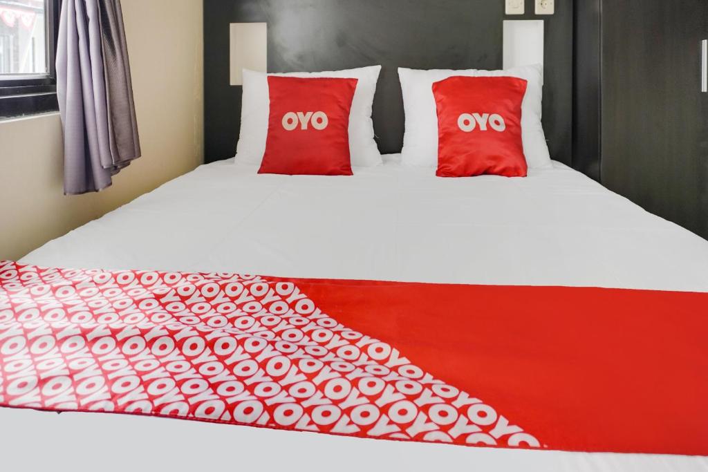 Postel nebo postele na pokoji v ubytování OYO 91646 fio colombus residence