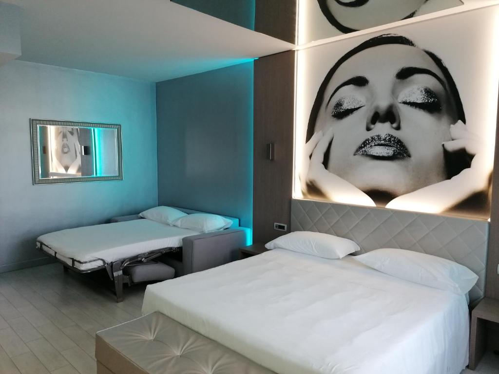 Postel nebo postele na pokoji v ubytování Hotel Camelia