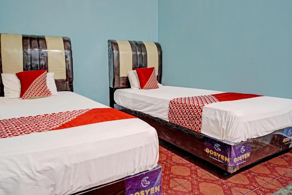 Postel nebo postele na pokoji v ubytování SPOT ON 91637 Hotel Adela
