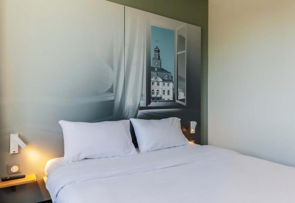 Postel nebo postele na pokoji v ubytování B&B HOTEL Freyming-Merlebach