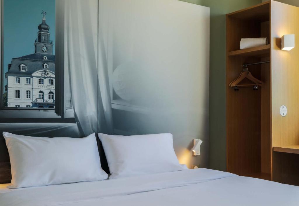 Postel nebo postele na pokoji v ubytování B&B HOTEL Freyming-Merlebach