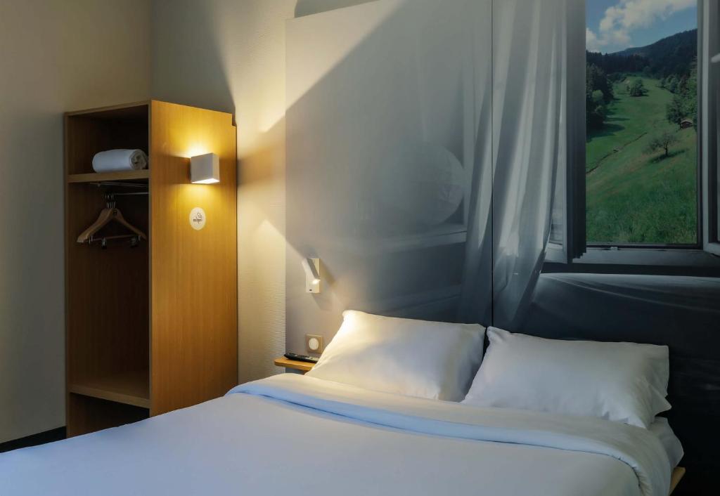 Postel nebo postele na pokoji v ubytování B&B HOTEL Freyming-Merlebach