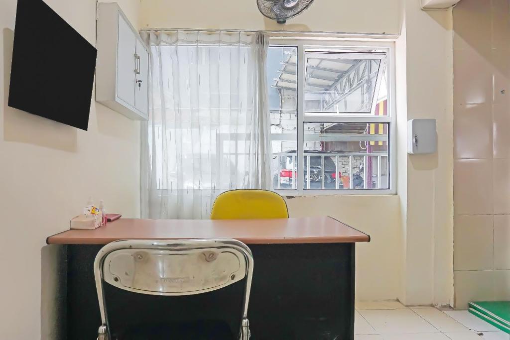 TV a/nebo společenská místnost v ubytování Super OYO Capital O 91790 S1 Residence