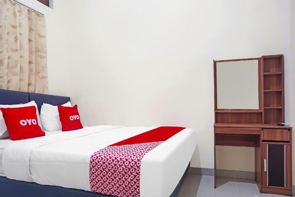 Postel nebo postele na pokoji v ubytování Super OYO Capital O 91790 S1 Residence