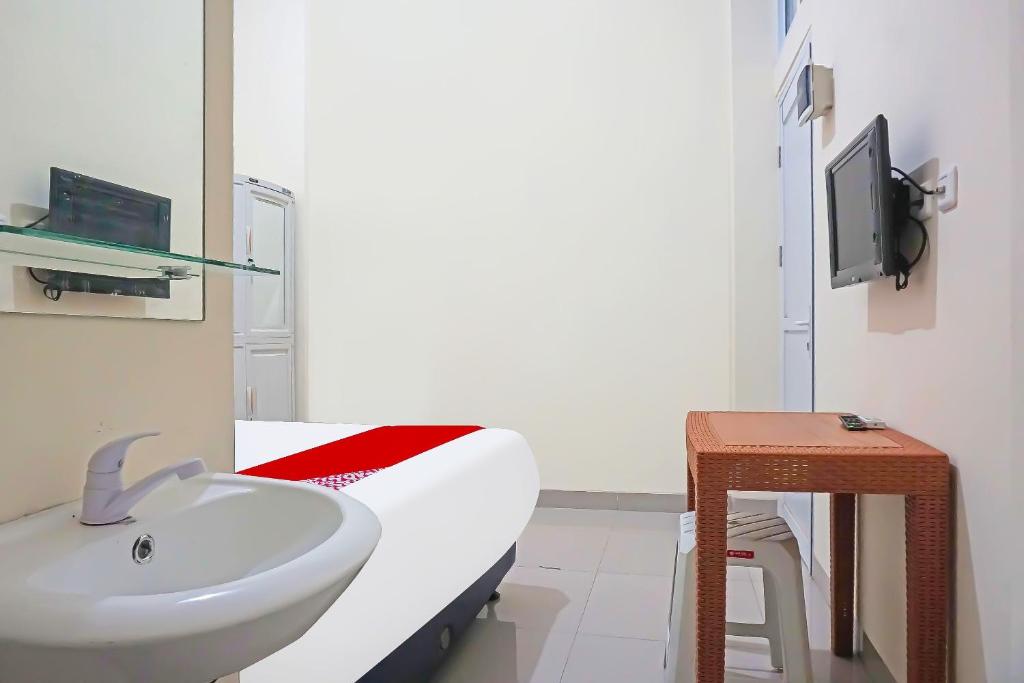 TV a/nebo společenská místnost v ubytování Super OYO Capital O 91790 S1 Residence