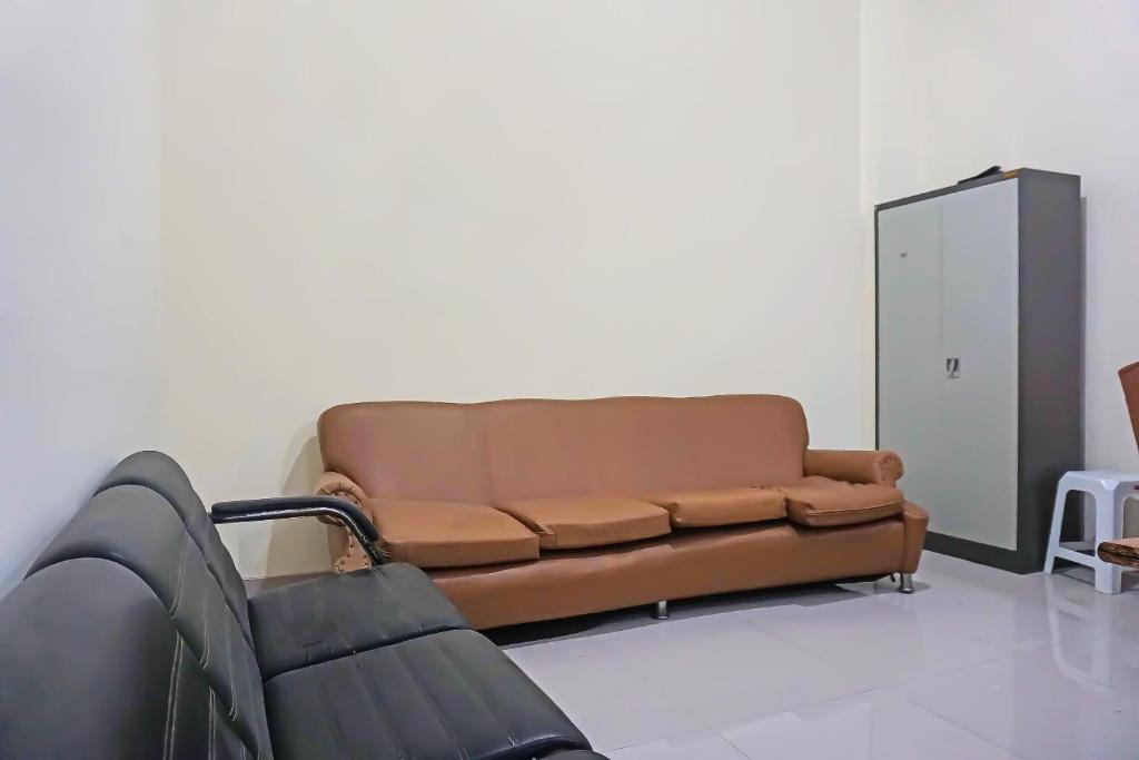 Posezení v ubytování Super OYO Capital O 91790 S1 Residence